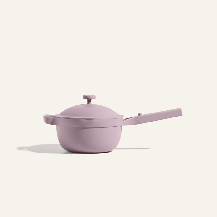 The Mini Perfect Pot 2.0, a pastel purple multifunctional pot with a long handle and matching lid, is centered against a plain light background.