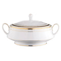 White ceramic tureen with gold trim on a white background