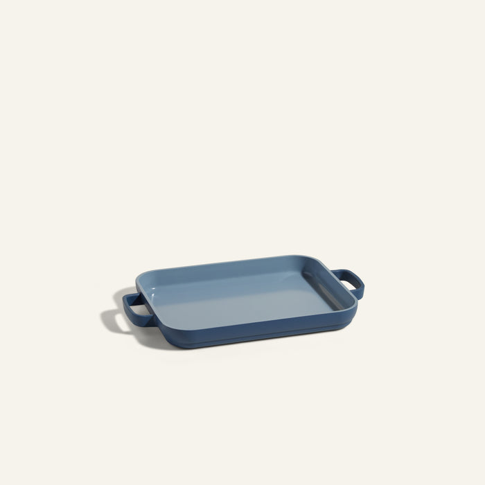 A rectangular blue Mini Griddle Pan with side handles is shown on a plain light background.