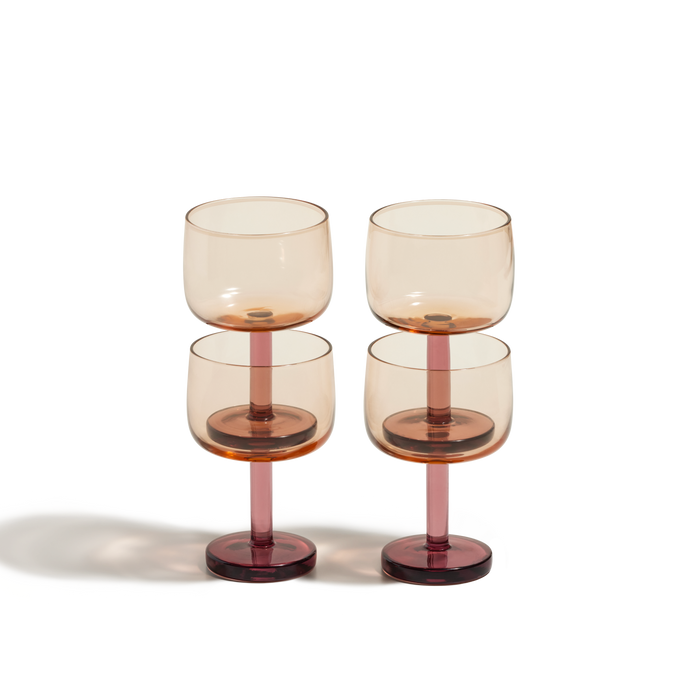 The Party Coupes set features four amber stemmed glasses with wide bowls, adding elegance to your glassware collection. Arranged neatly in two rows on a white background, they’re perfect for entertaining.