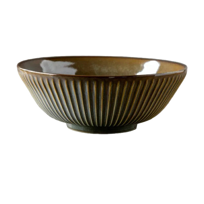 Brown ceramic bowl with ribbed design on a gray background